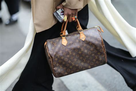 prada or louis vuitton bag